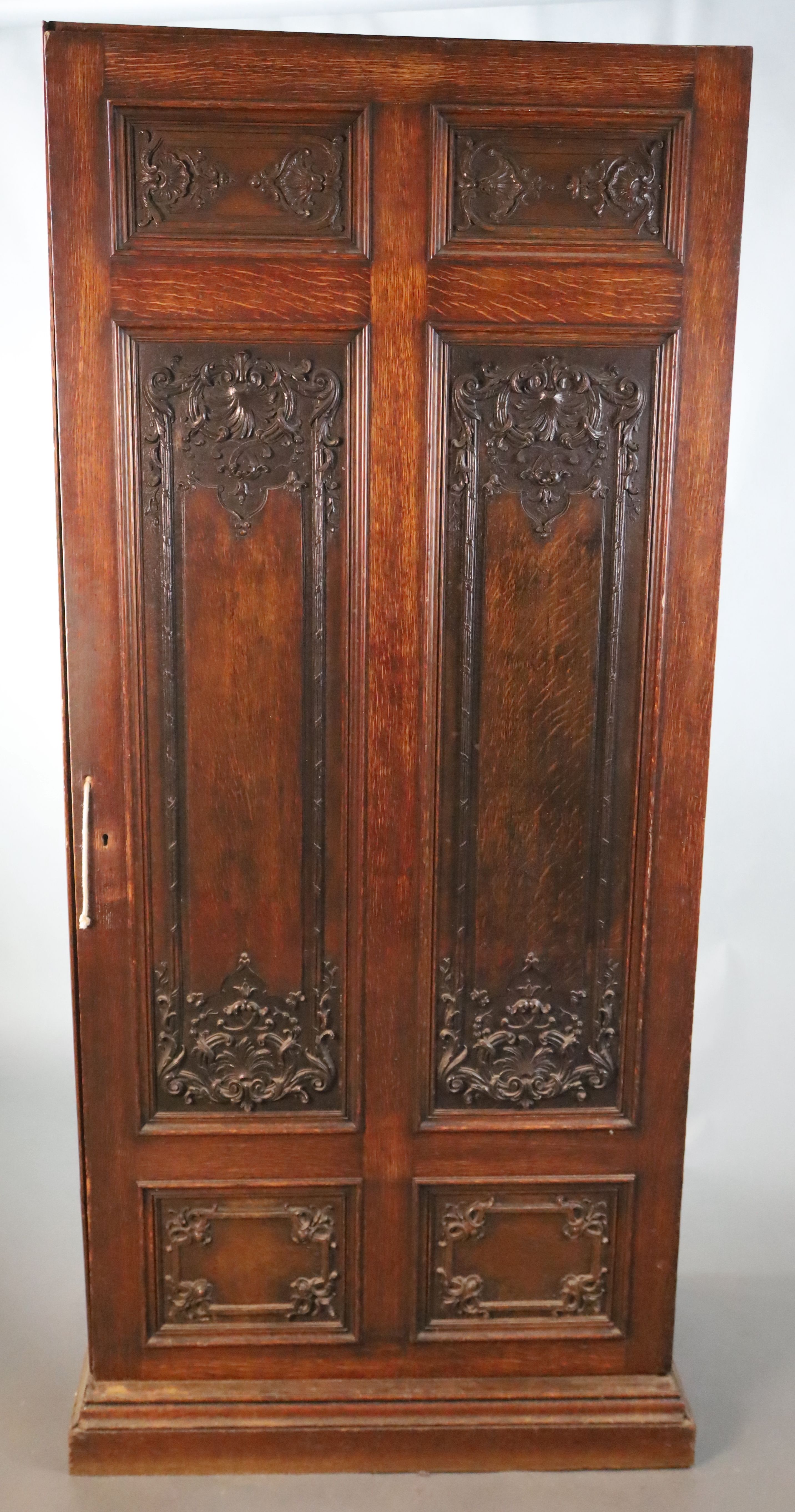 A late 19th century French oak hall cupboard, W.119.5cm D.51cm H.200.5cm